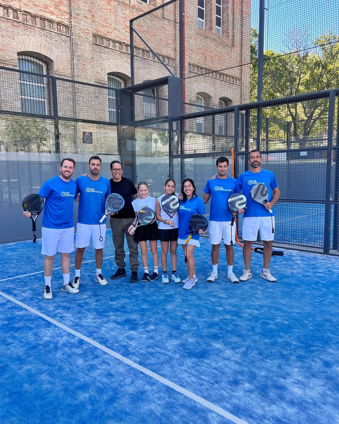 Group of padel players on court in Sevilla