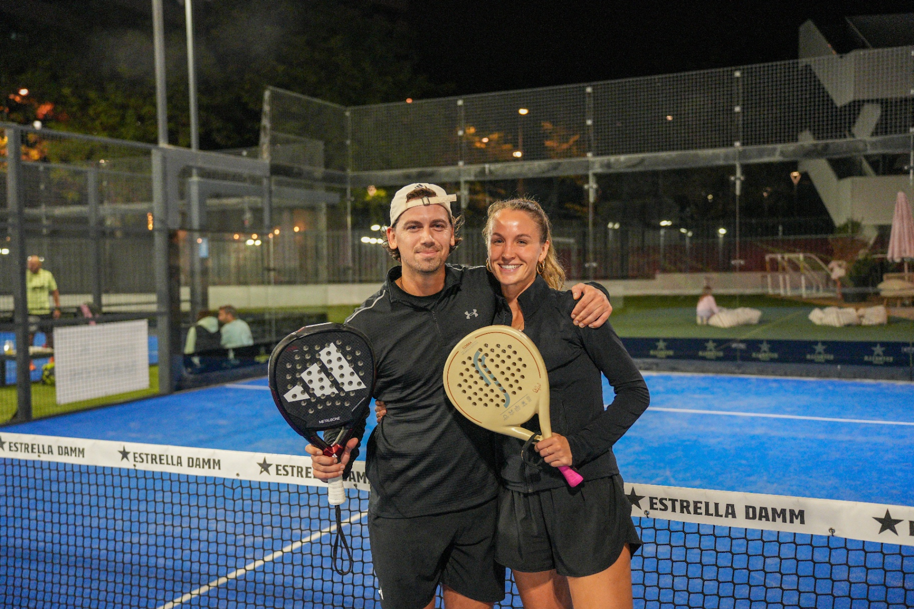 Padel couple with rackets